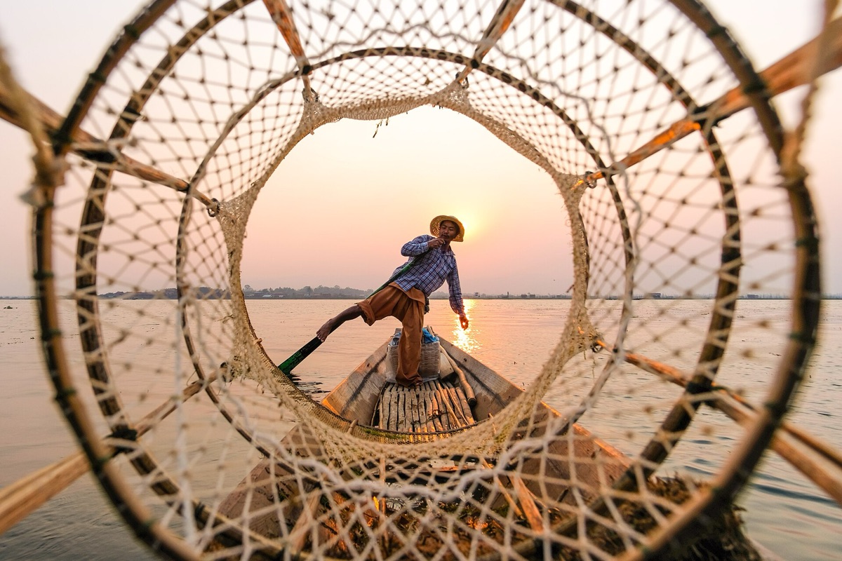 Fishing boat with fisherman in turquoise water
