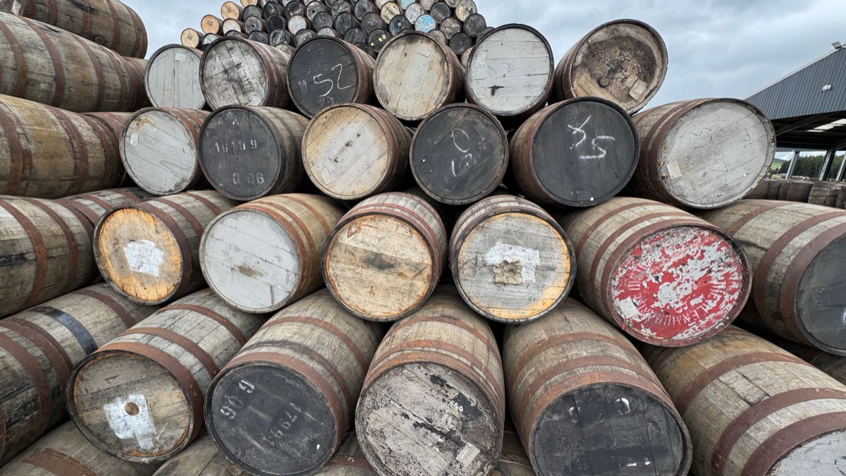 distillery sign with whiskey casks