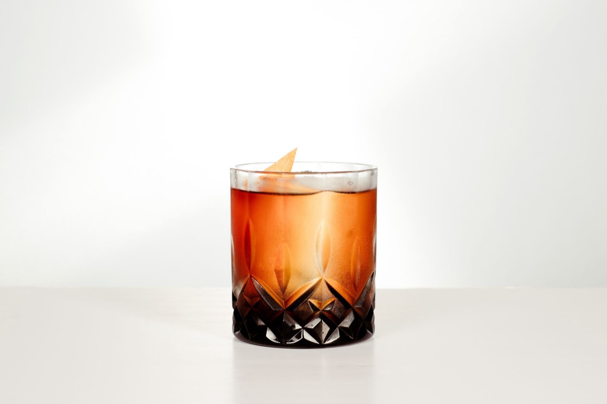 whiskey glass with ice cube